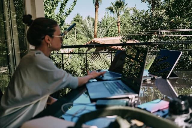Digital nomad working remotely from a Marrakech rooftop